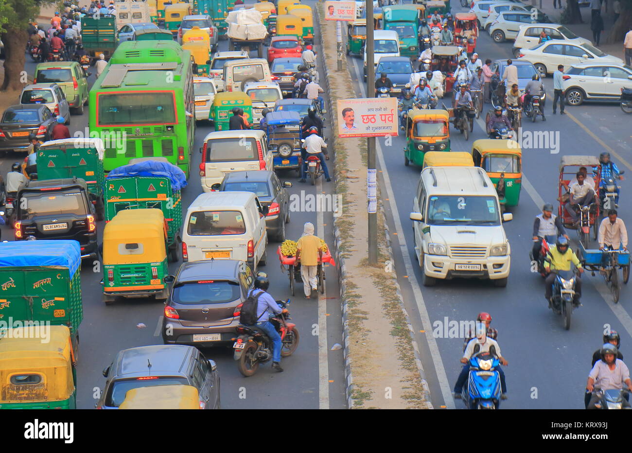 People commute in downtown New Delhi India Stock Photo