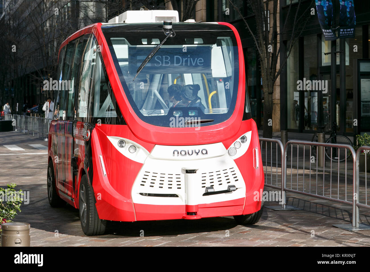Tokyo, Japan. 22nd Dec, 2017. A self-driving electric shuttle bus Navya Arma is introduced at a press event on December 22, 2017, Tokyo, Japan. The driverless French electric vehicle (EV) developed by Navya Technologies SAS can carry up to 15 passengers and reach 45kmh. Japan's telecom giant SoftBank's subsidiary SB Drive and Mitsubishi Estate Co., Ltd. collaborated on the vehicle, and Japanese government is aiming to promote the autonomous driving technology ahead of the Tokyo 2020 Olympics. Credit: Rodrigo Reyes Marin/AFLO/Alamy Live News Stock Photo