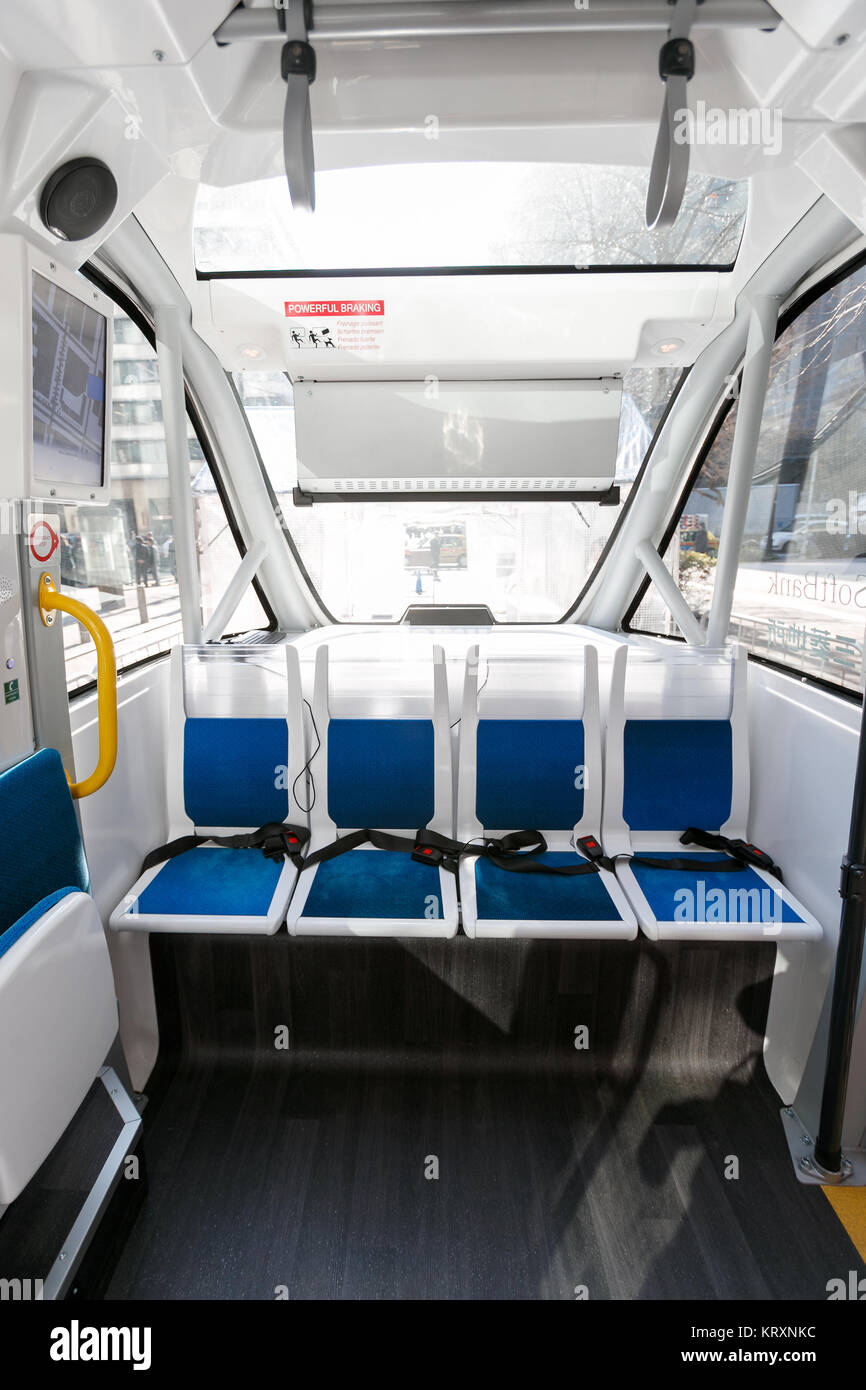 Tokyo, Japan. 22nd Dec, 2017. The interior of a self-driving electric shuttle bus Navya Arma is seen during a press event on December 22, 2017, Tokyo, Japan. The driverless French electric vehicle (EV) developed by Navya Technologies SAS can carry up to 15 passengers and reach 45kmh. Japan's telecom giant SoftBank's subsidiary SB Drive and Mitsubishi Estate Co., Ltd. collaborated on the vehicle, and Japanese government is aiming to promote the autonomous driving technology ahead of the Tokyo 2020 Olympics. Credit: Rodrigo Reyes Marin/AFLO/Alamy Live News Stock Photo