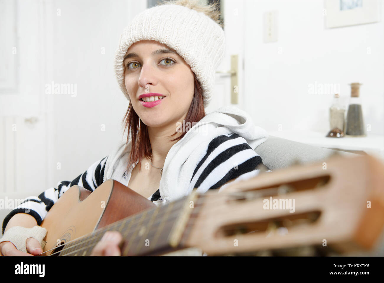 beautiful young woman playing the acoustic guitar Stock Photo - Alamy