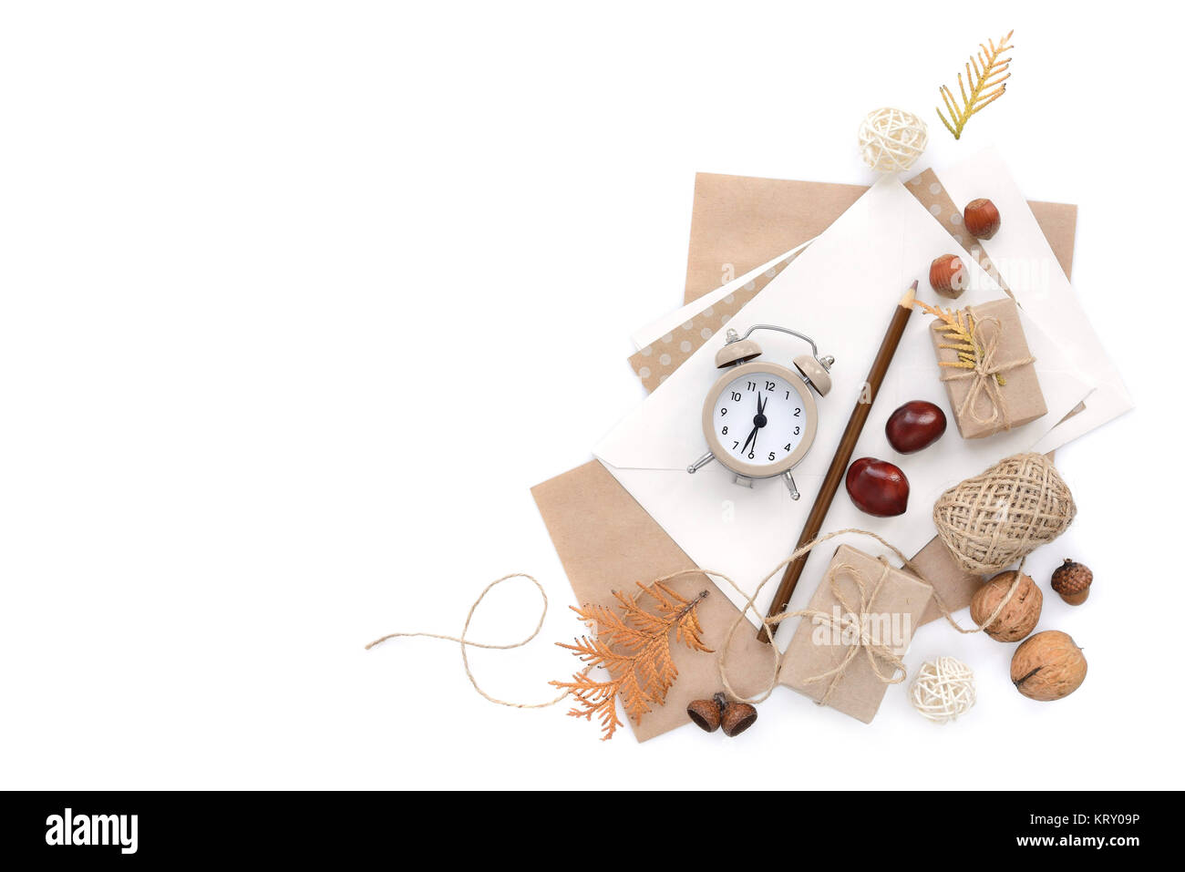 Autumn background with pencil, envelopes and an alarm clock. Top view. Space for your text. Stock Photo