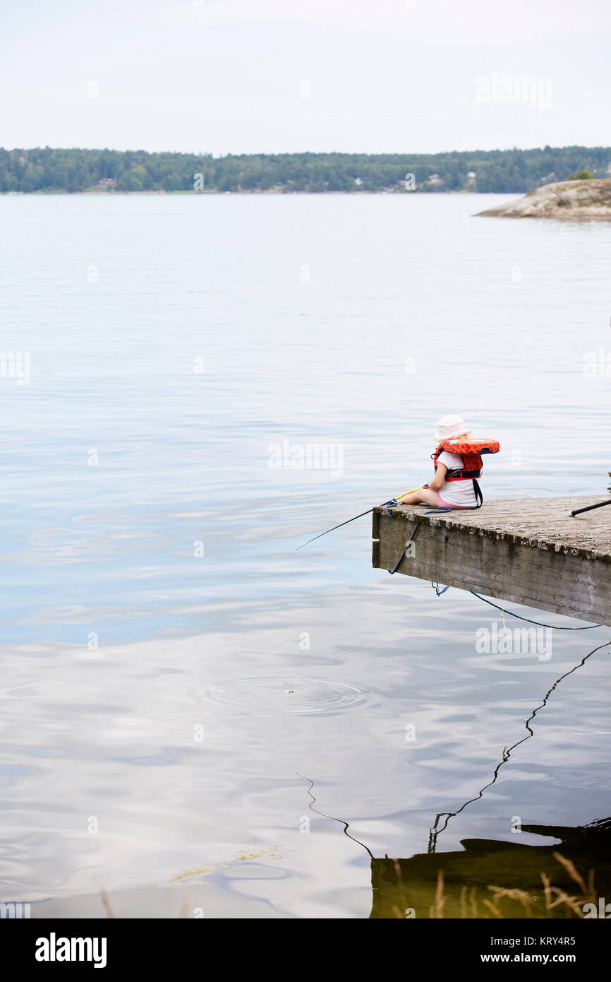 Young girl fishing Stock Photo