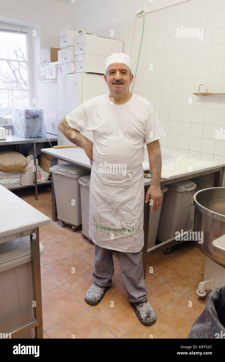 Portrait of chef in kitchen Stock Photo