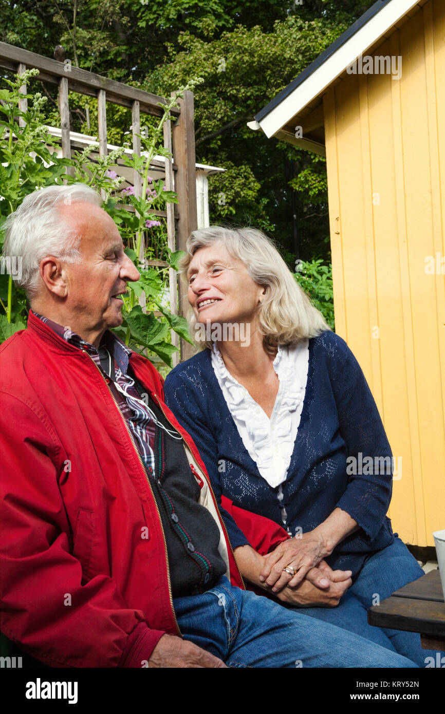 Senior couple sitting together Stock Photo