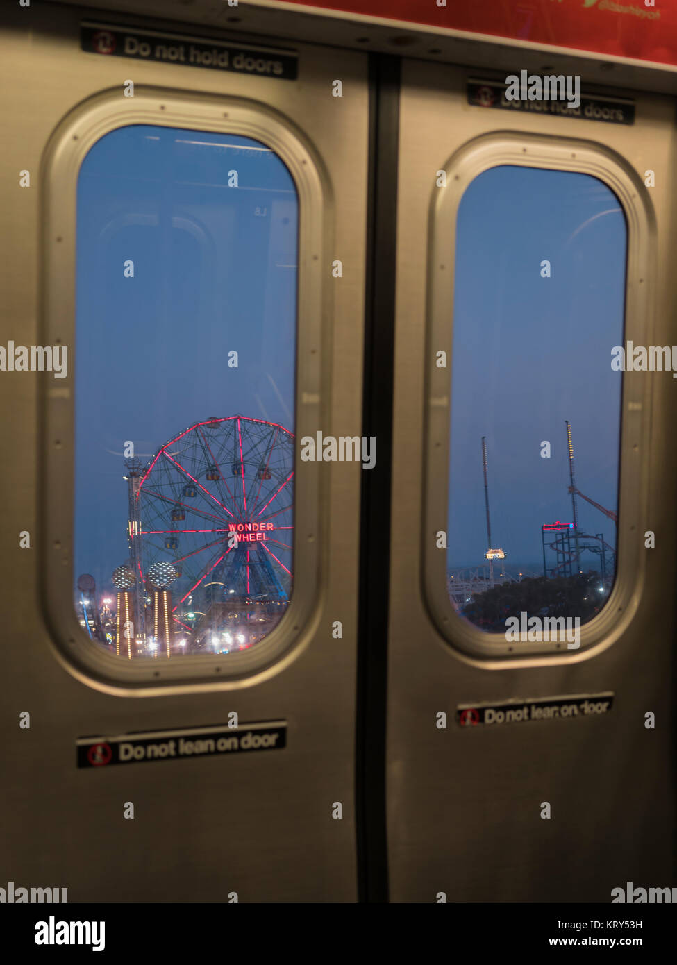 Rollercoaster behind subway doors in Coney Island, New York City Stock Photo