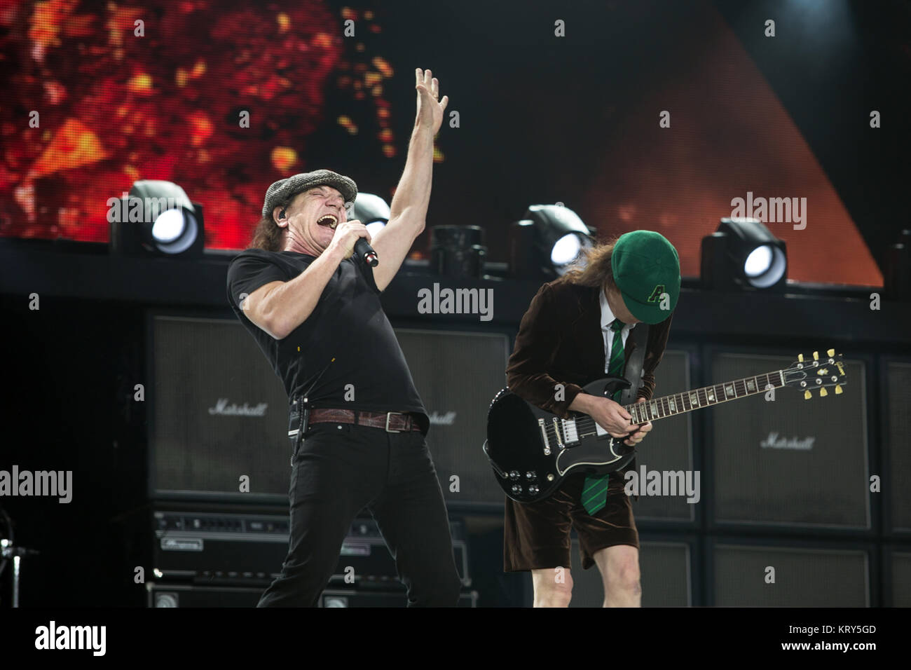 The Australian rock band AC/DC performs a live concert at Valle Hovin Stadion in Oslo as part of the Rock or Bust World 2015 Tour. Here vocalist Brian Johnson seen live on stage with guitarist Angus Young. Norway, 17/07 2015. Stock Photo