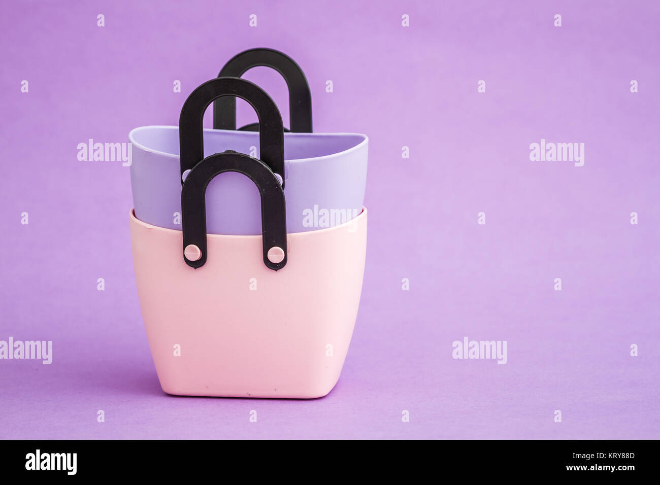 Colorful Small Decorative Plastic Bags with Handle on Purple Background