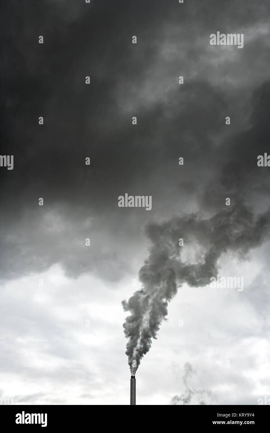 Steaming chimney of power plant Stock Photo