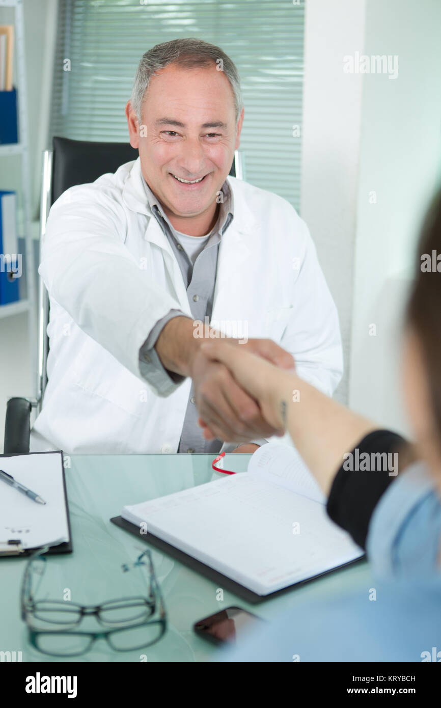 doctor shaking hands with a patient Stock Photo Alamy