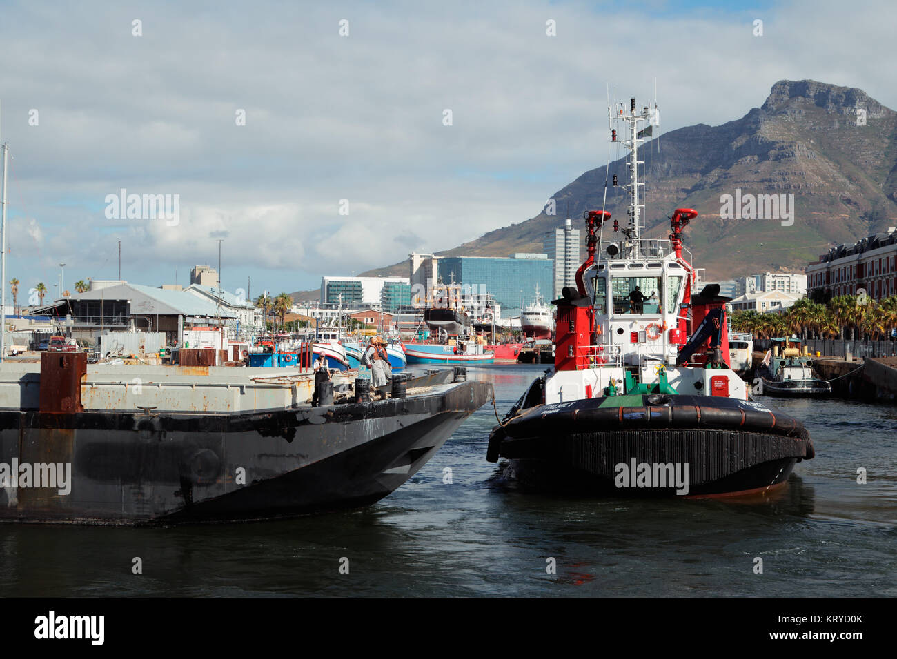 CAPE TOWN, SOUTH AFRICA - FEBRUARY 20, 2012: Victoria and Alfred Waterfront, harbor with boats and part of the famous Table Mountain Stock Photo