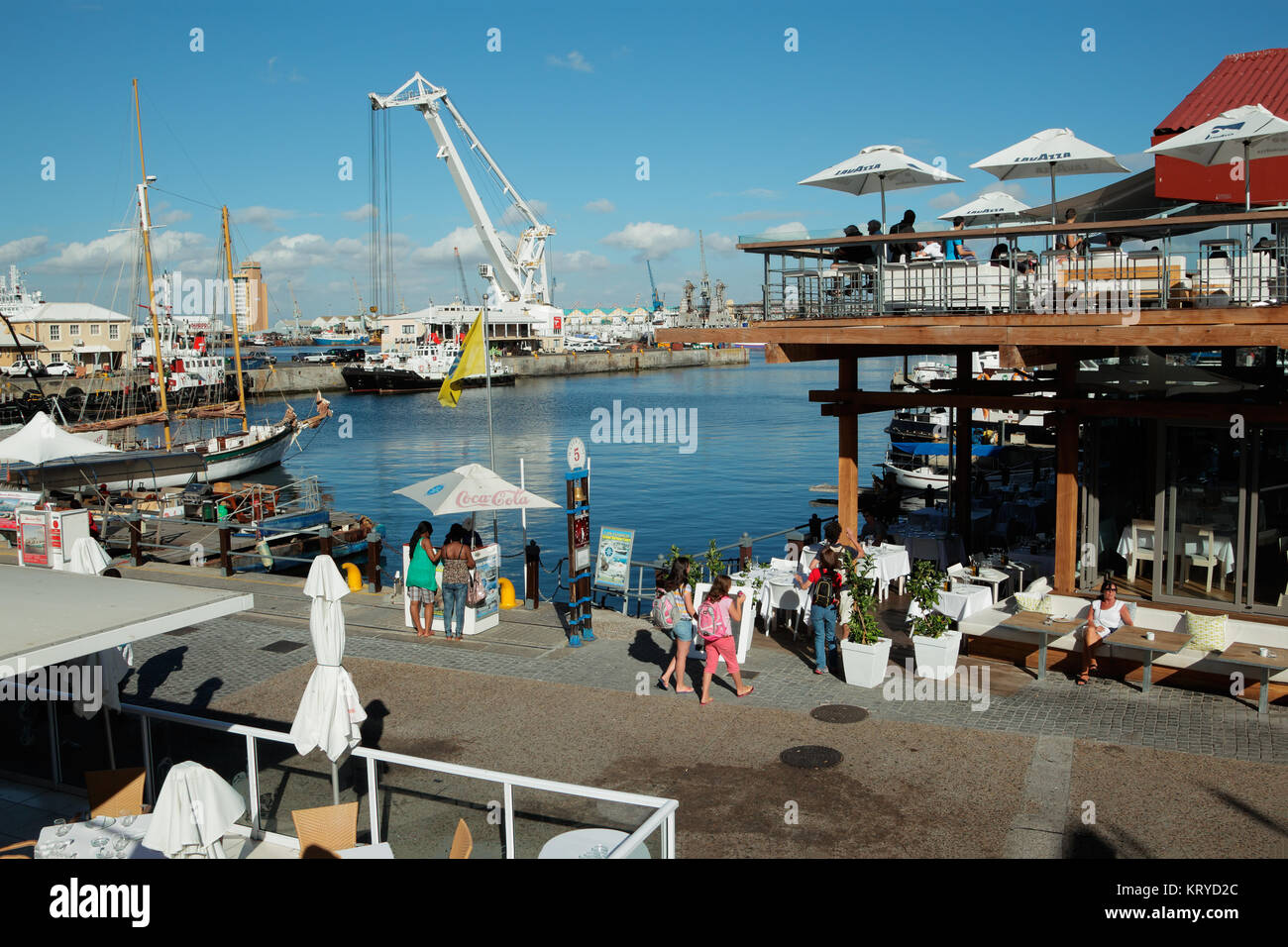 CAPE TOWN, SOUTH AFRICA - FEBRUARY 20, 2012: Victoria and Alfred Waterfront, harbor with shops, restaurants and boats popular with tourists. Stock Photo
