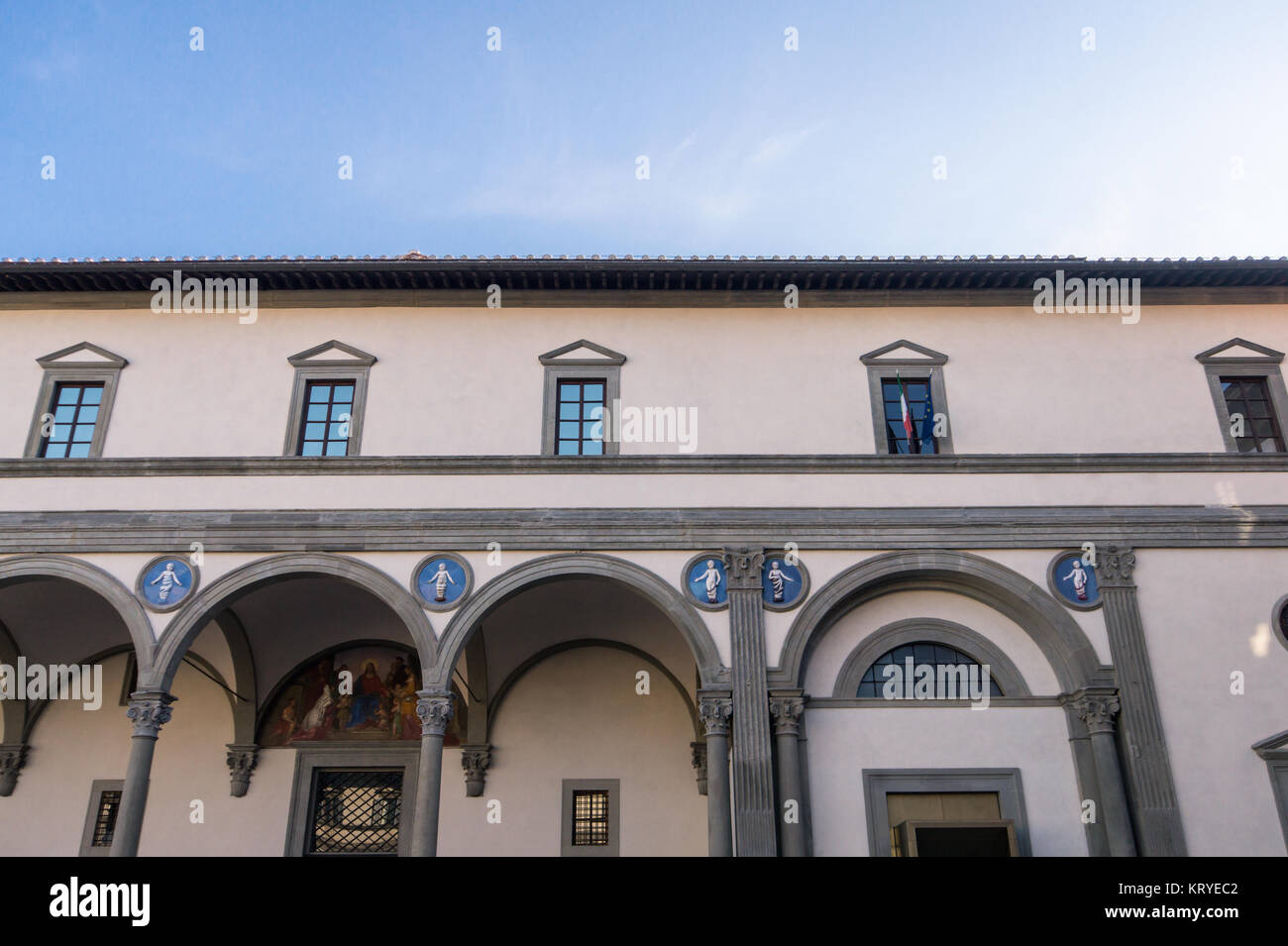 Filippo Brunelleschi, Hospital of the Innocents (Ospedale degli Innocenti) in Florence, facade, 1419 -1427, terracotta tondos by Andrea della Robbia Stock Photo