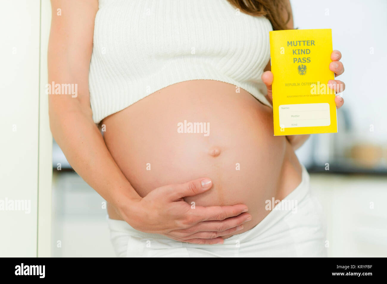 Schwangere Frau mit Mutter-Kind-Pass - pregnant woman with Mother-Child-Pass, Austria Stock Photo