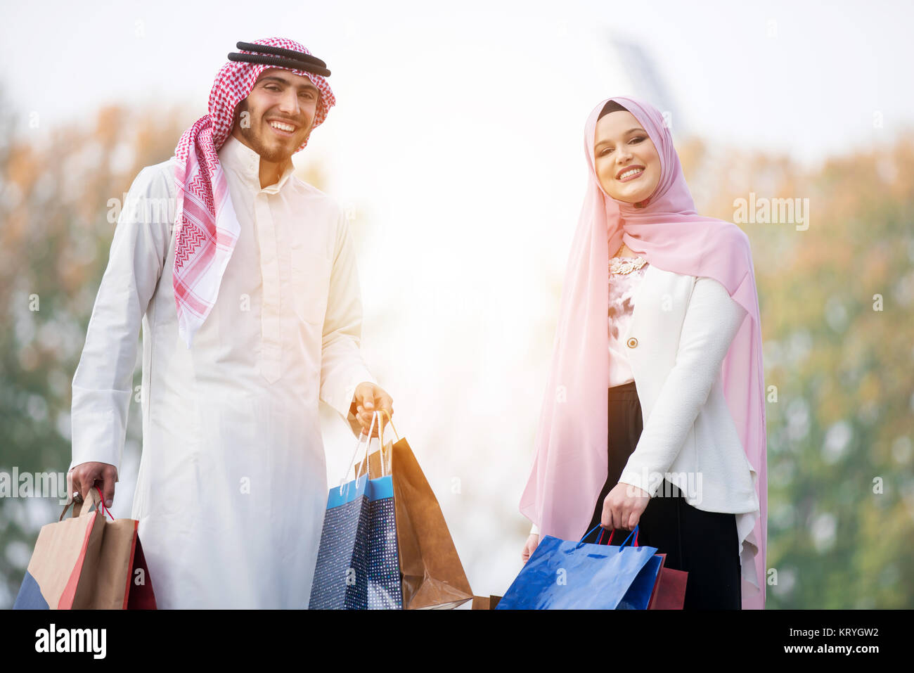 Lovely Muslim Couple Taking A Walk After Shopping Concept Stock