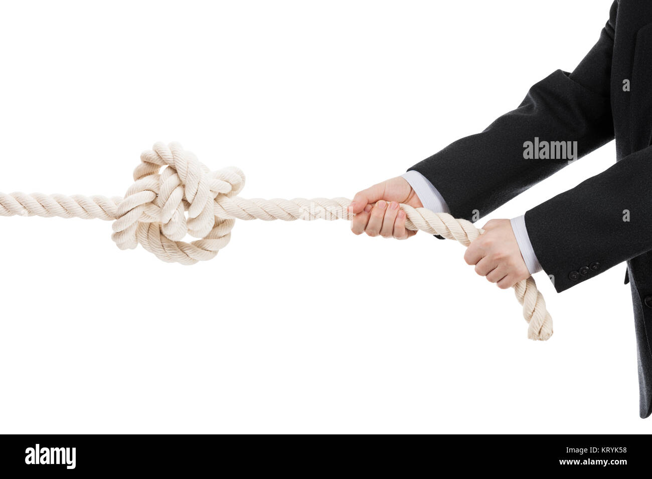 Competition concept - business man in black suit hand holding or pulling rope with tied knot white isolated Stock Photo