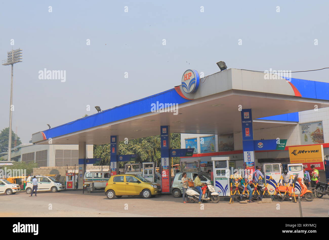 People buy petrol at HP petrol station in New Delhi India. Hindustan Petroleum HP is Indian state owned oil and natural gas company headquartered in M Stock Photo