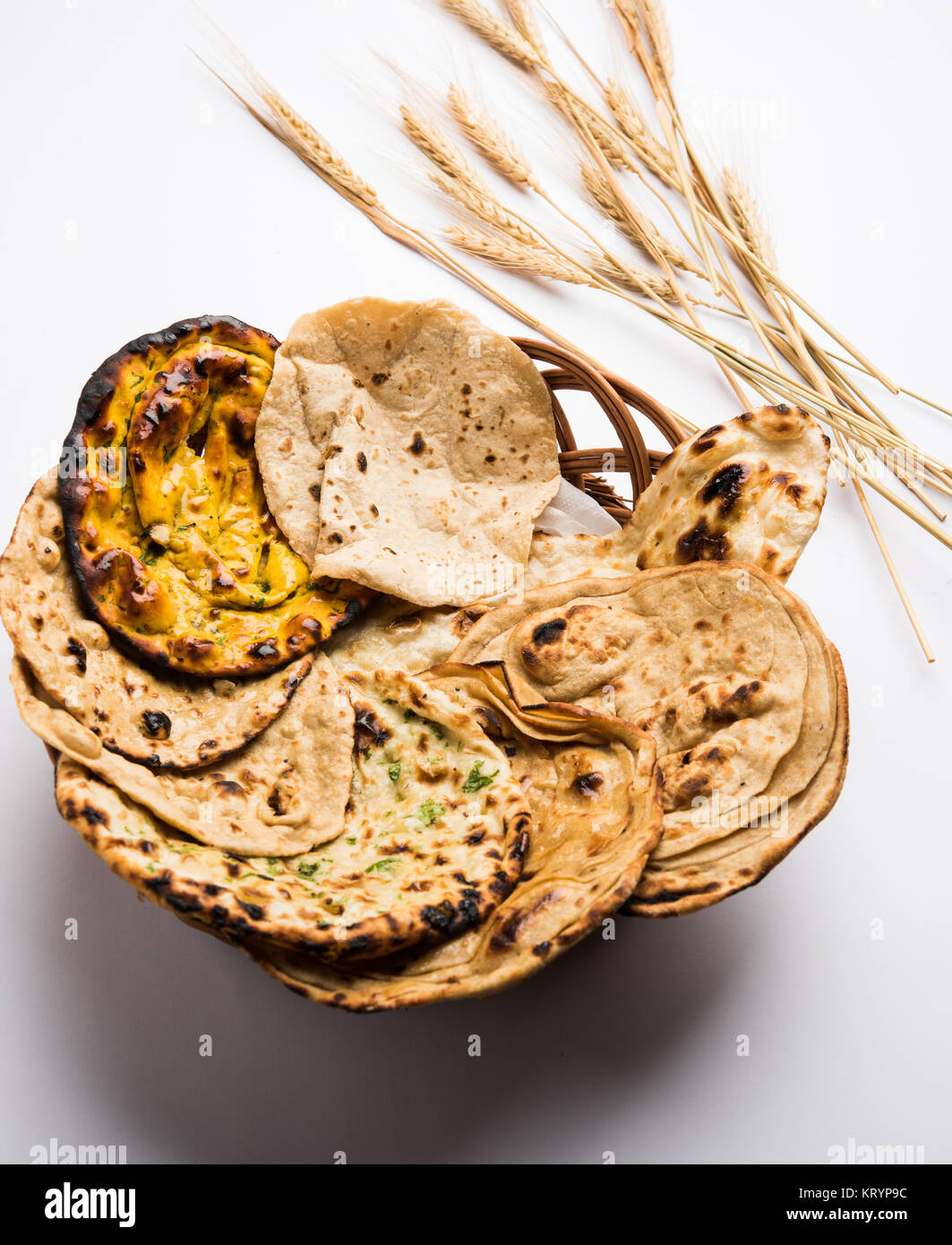 Assorted Indian Bread Basket includes chapati, tandoori roti or naan, paratha, kulcha, fulka