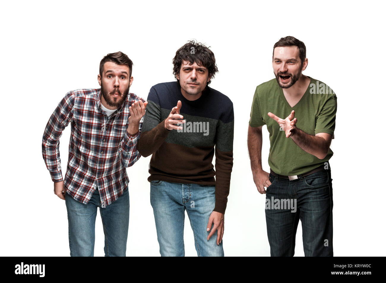 The three men are smiling, looking at camera Stock Photo - Alamy