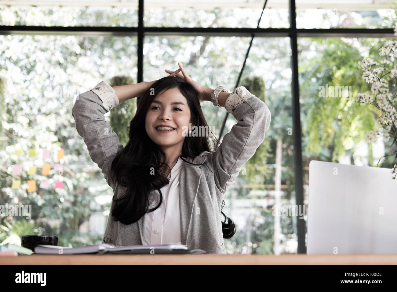 young start up woman put hand on head at office. freelance female entrepreneur glad with successful project. businesswoman working at workplace. succe Stock Photo