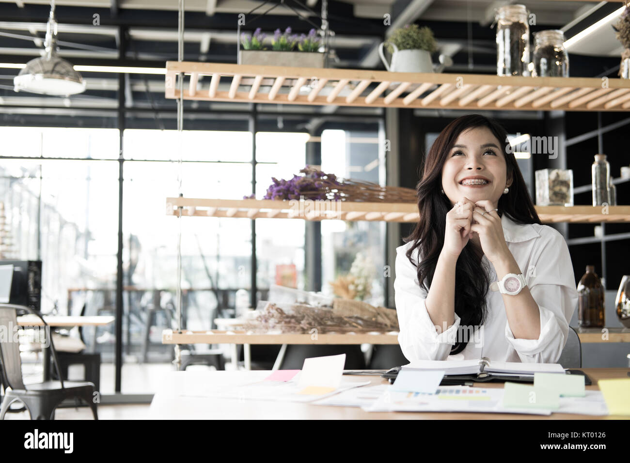 young start up woman feeling happy at office. freelance female entrepreneur glad with successful project. businesswoman working at workplace. success, Stock Photo
