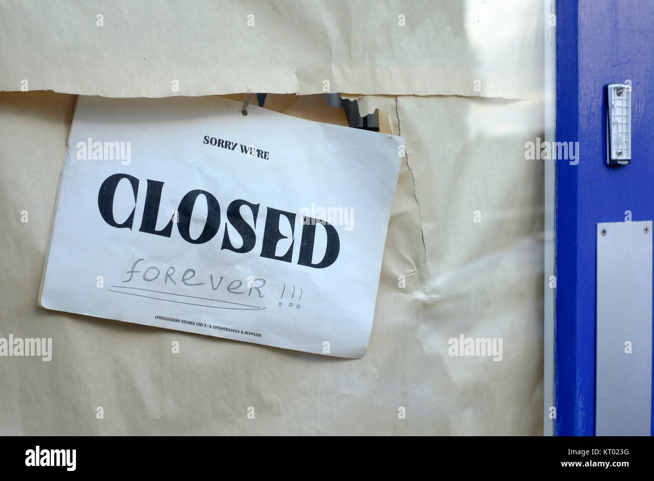 a closed sign with the word forever hand written underneath hangs in the window of an out of business shop england uk Stock Photo
