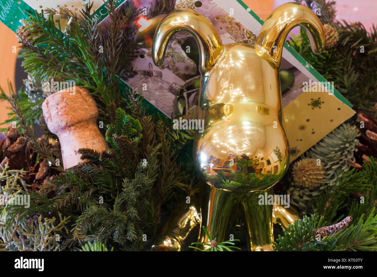 Christmas tree fir and cork from champagne and gold dog Stock Photo