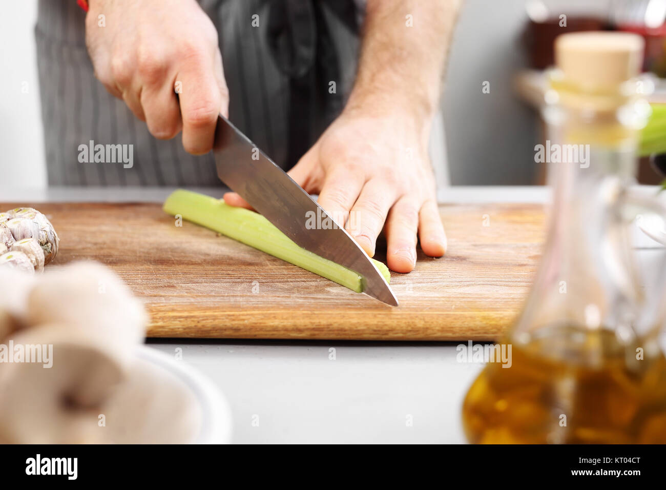cutting vegetables. slicing knife vegetables. cook chopped vegetables on a chopping board. Stock Photo