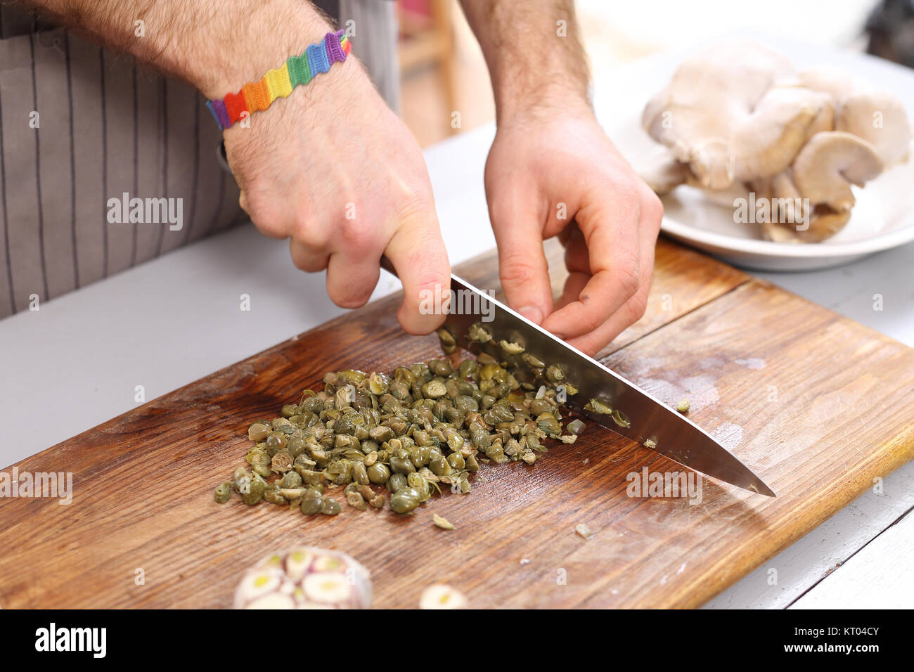 capers. chef knife cut capers. Stock Photo