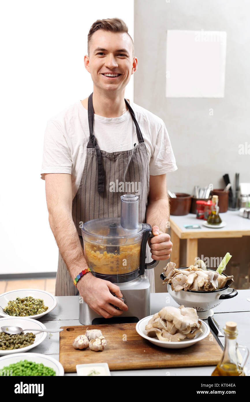 cook. young chef prepares vegetable vegan dish Stock Photo