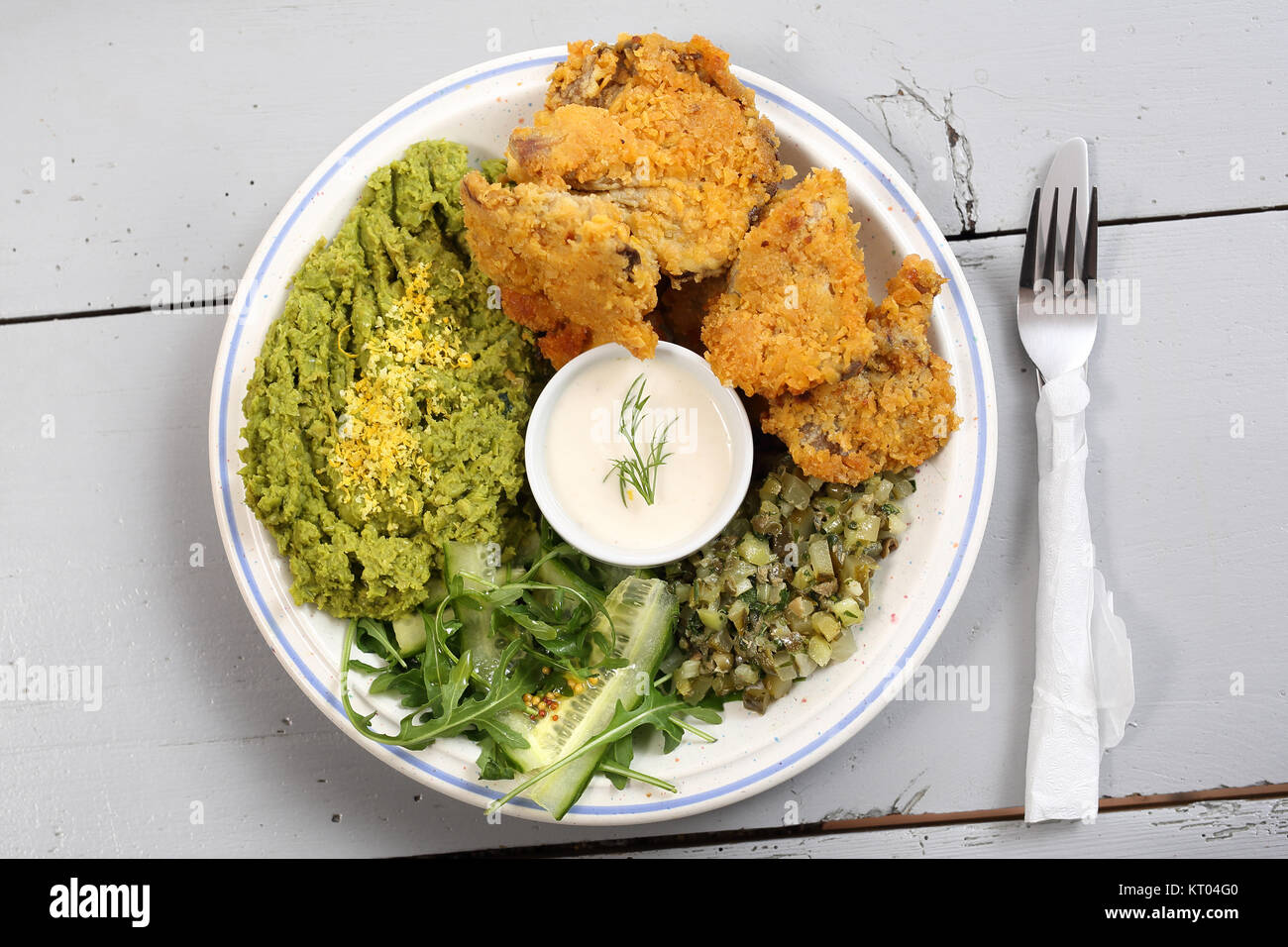 a dish of oyster mushrooms. vegan dish. oyster topped with bread crumbs mashed green peas Stock Photo