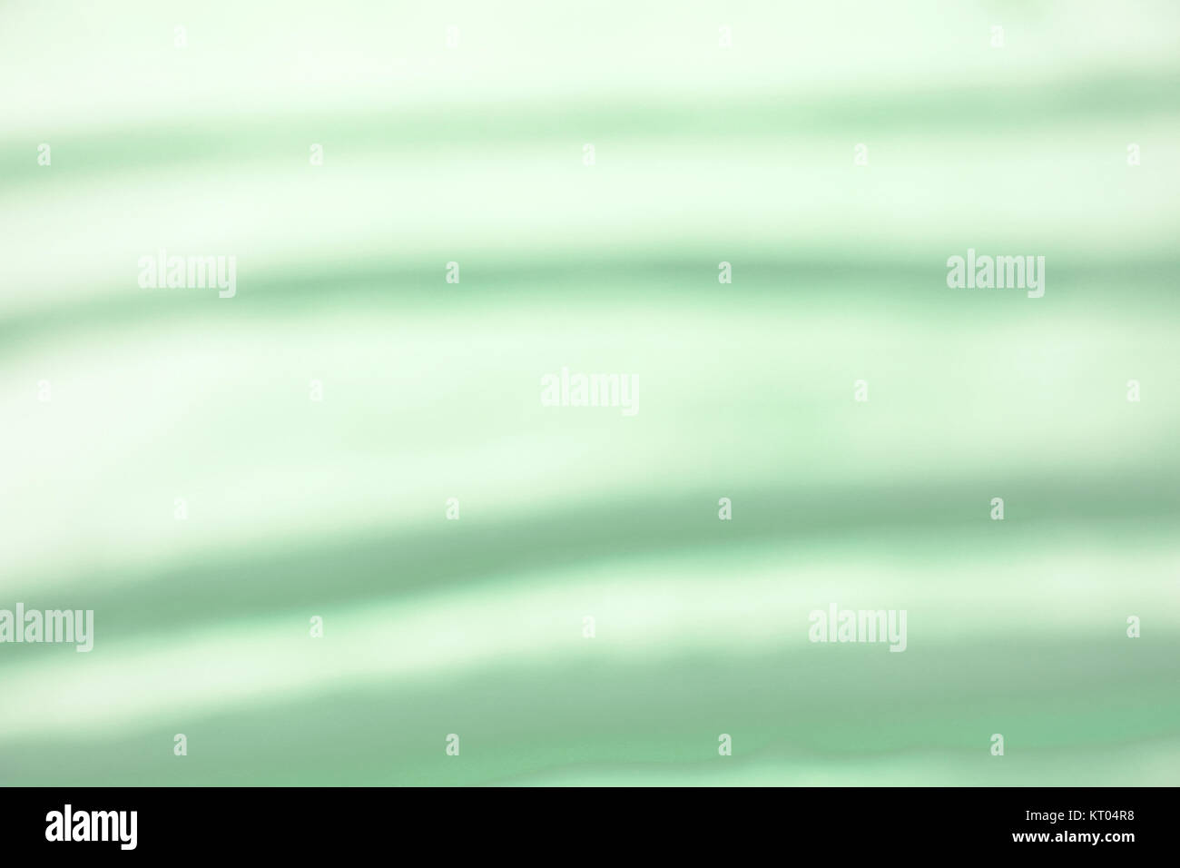 grüner, unscharfer Hintergrund mit Streifen Stock Photo