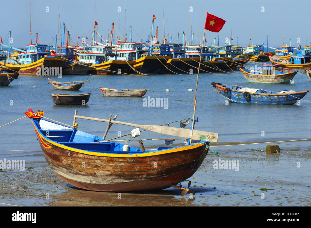 Many fishing boats line the shore of a village near Mui Ne in Vietnam South East Asia. Stock Photo