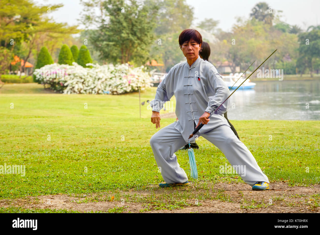 BANGKOK, THAILAND - FEBRUARY 20, 2016: Unidentified group of people practice Chinese sword with Tai Chi Chuan in a park Stock Photo