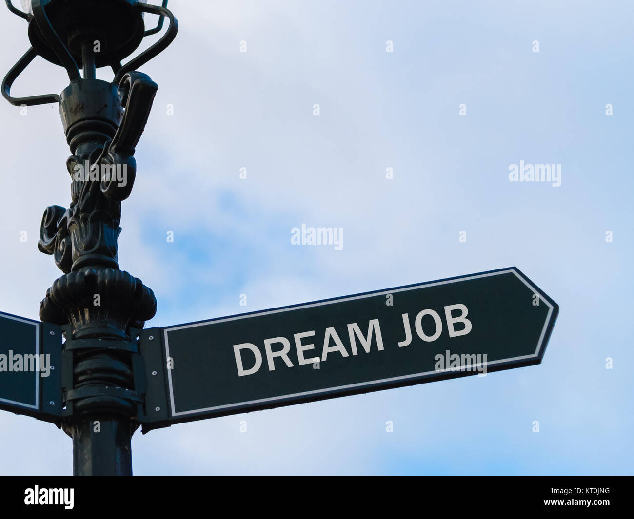 DREAM JOB directional sign on guidepost Stock Photo - Alamy