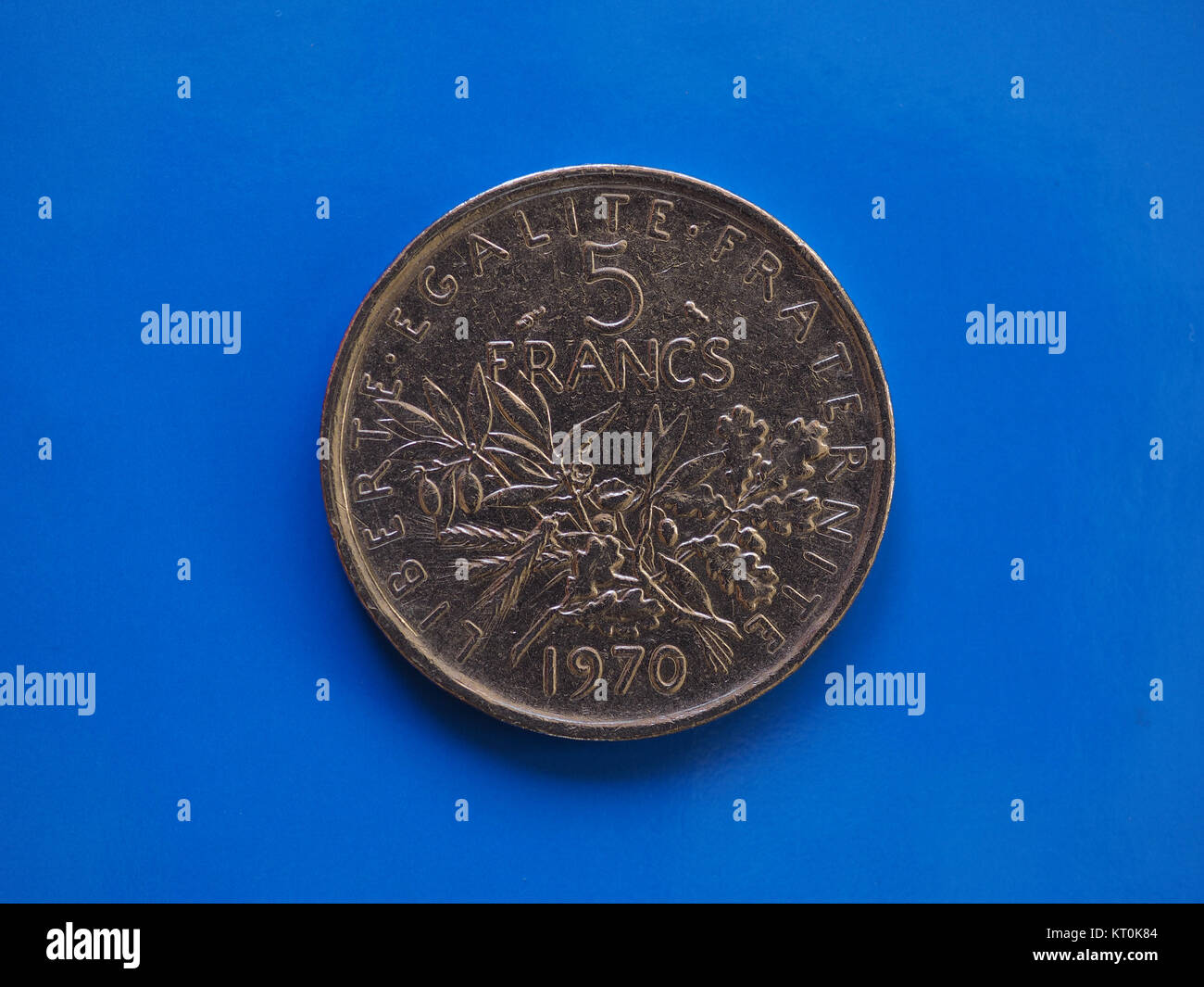 5 francs coin, France over blue Stock Photo