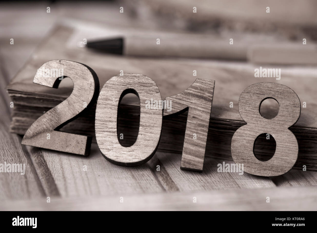 four wooden numbers forming the number 2018, as the new year, next to a ...