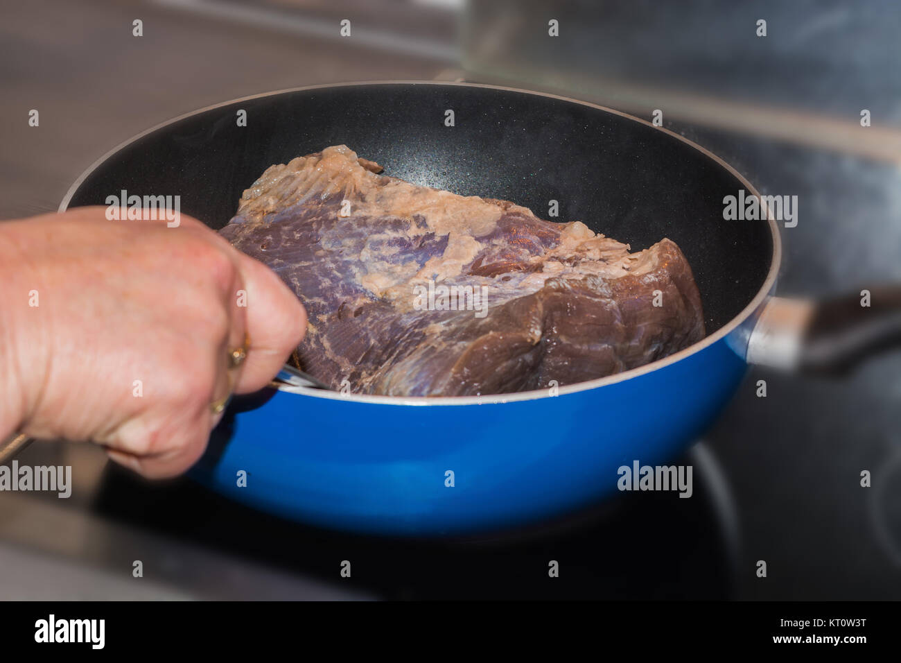 fresh roast beef in a frying pan Stock Photo Alamy