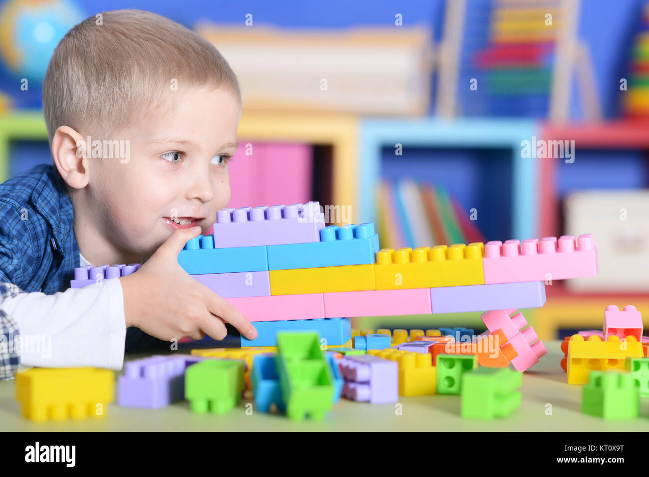 boy playing with colorful plastic blocks Stock Photo - Alamy