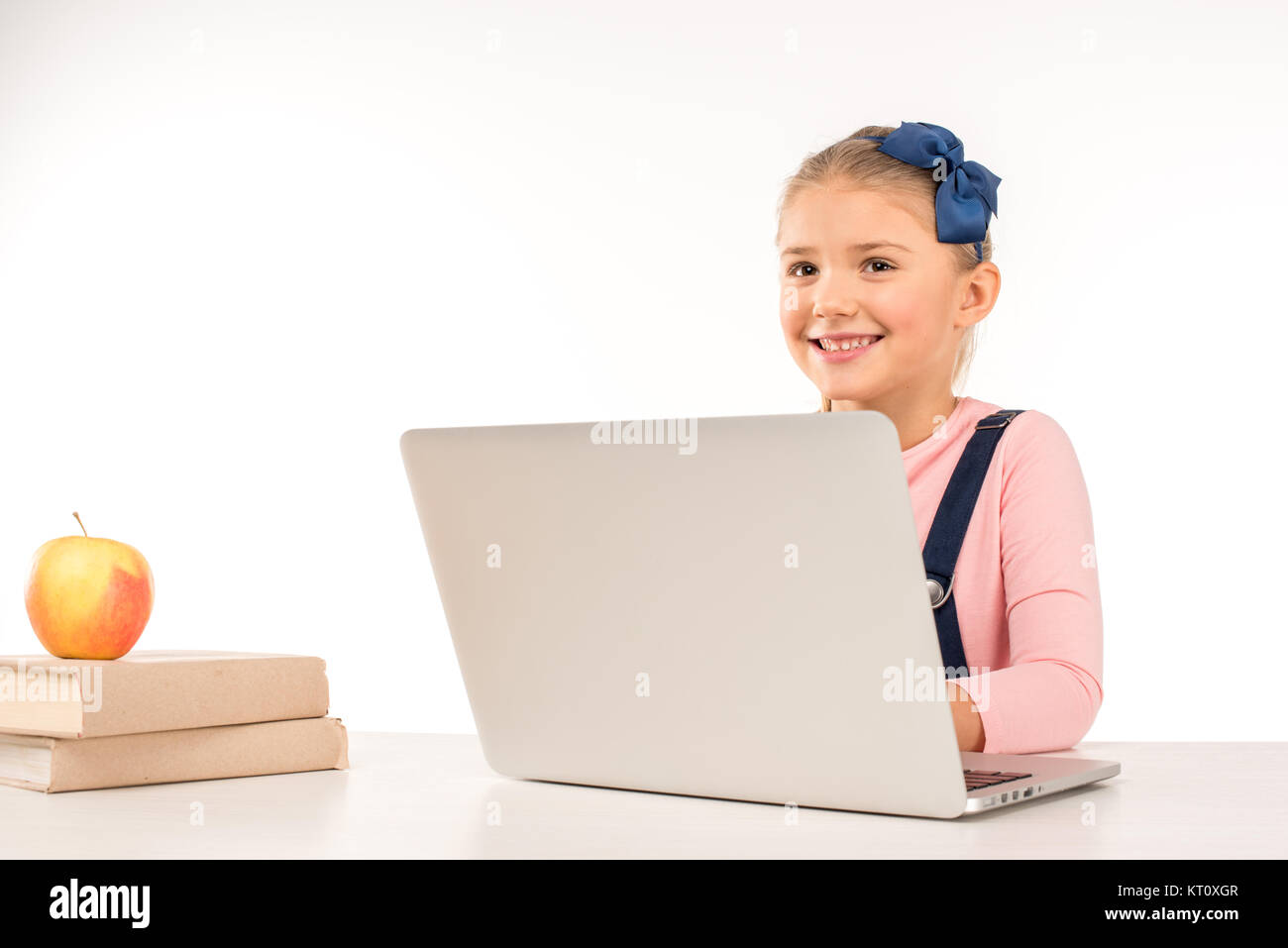 Smiling schoolgirl with laptop Stock Photo - Alamy