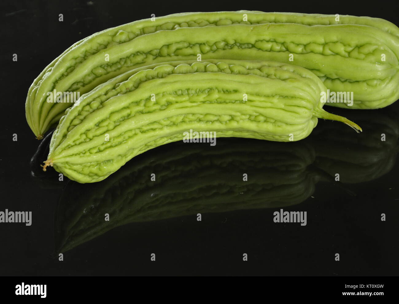 bitter cucumber on black kitchen counter Stock Photo Alamy