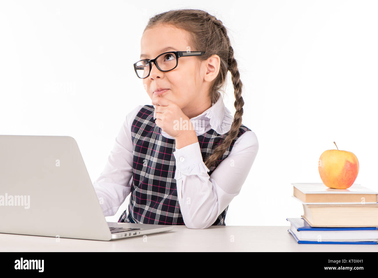 Schoolgirl at desk with laptop Stock Photo - Alamy