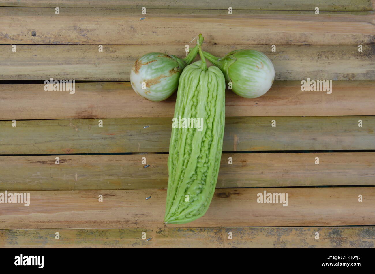 bitter cucumber and egg plant on bamboo table Stock Photo Alamy
