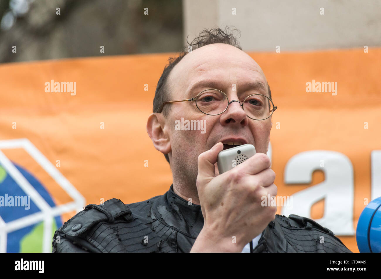 Pete Deane speaking at Campaign Against Climate Change 'Red Line' protest against inadequate climate deal from COP21 Paris talks. Stock Photo