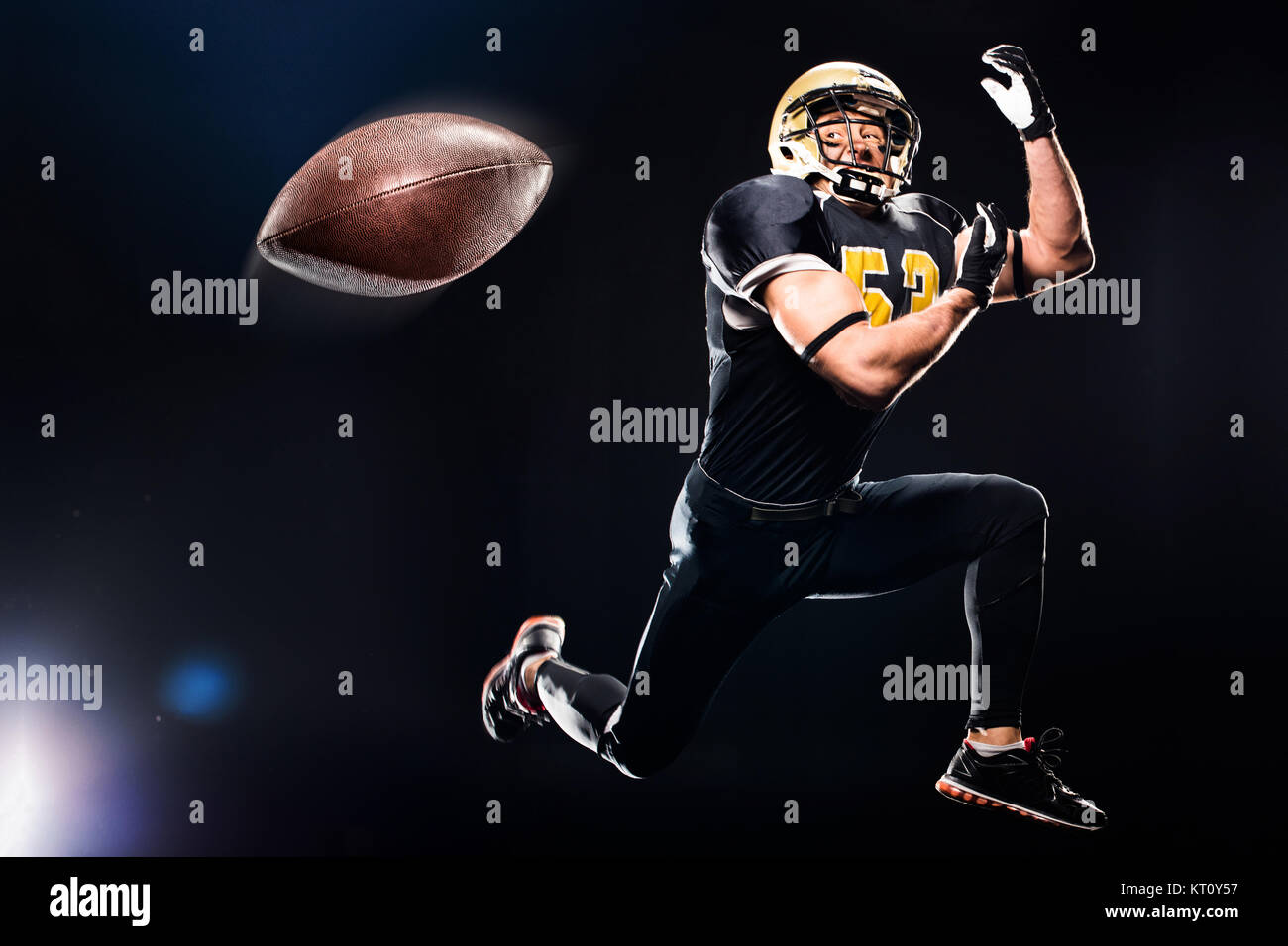 Football player catching ball Stock Photo Alamy
