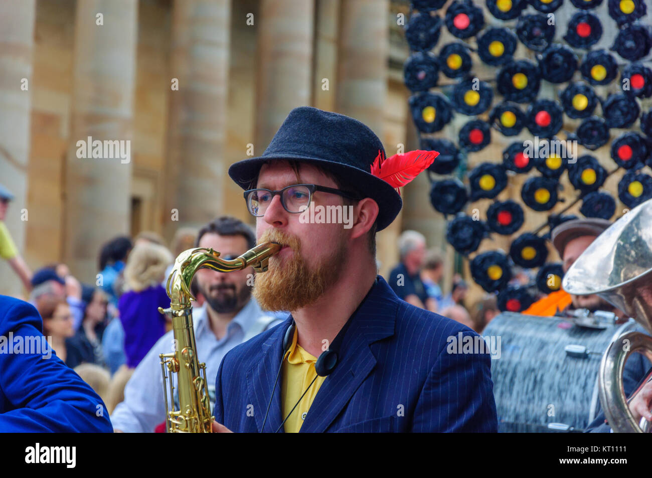 Male musician wearing a trilby hat with 