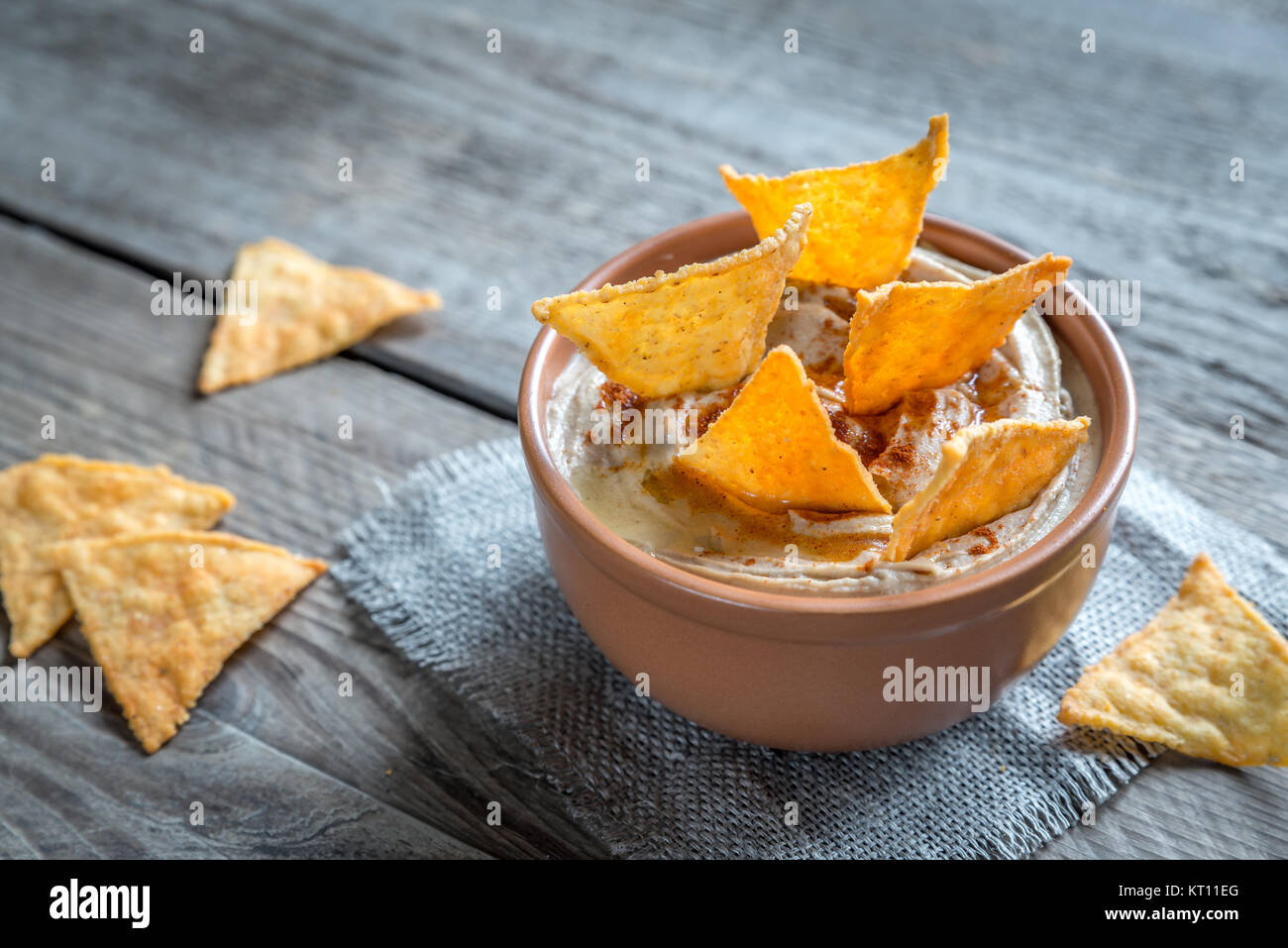 A bowl of hummus with corn chips Stock Photo Alamy