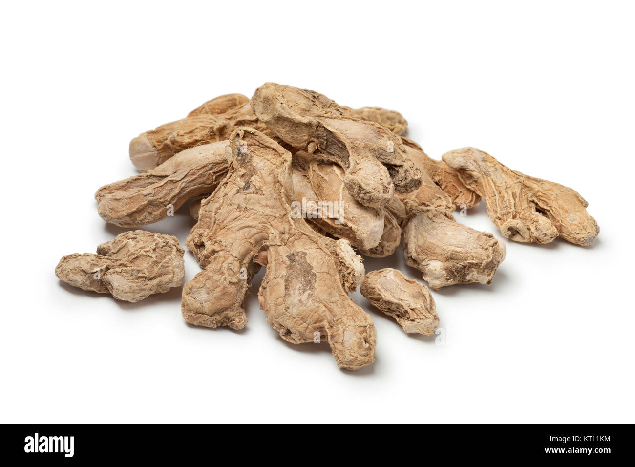 Heap of dried ginger roots on white background Stock Photo Alamy