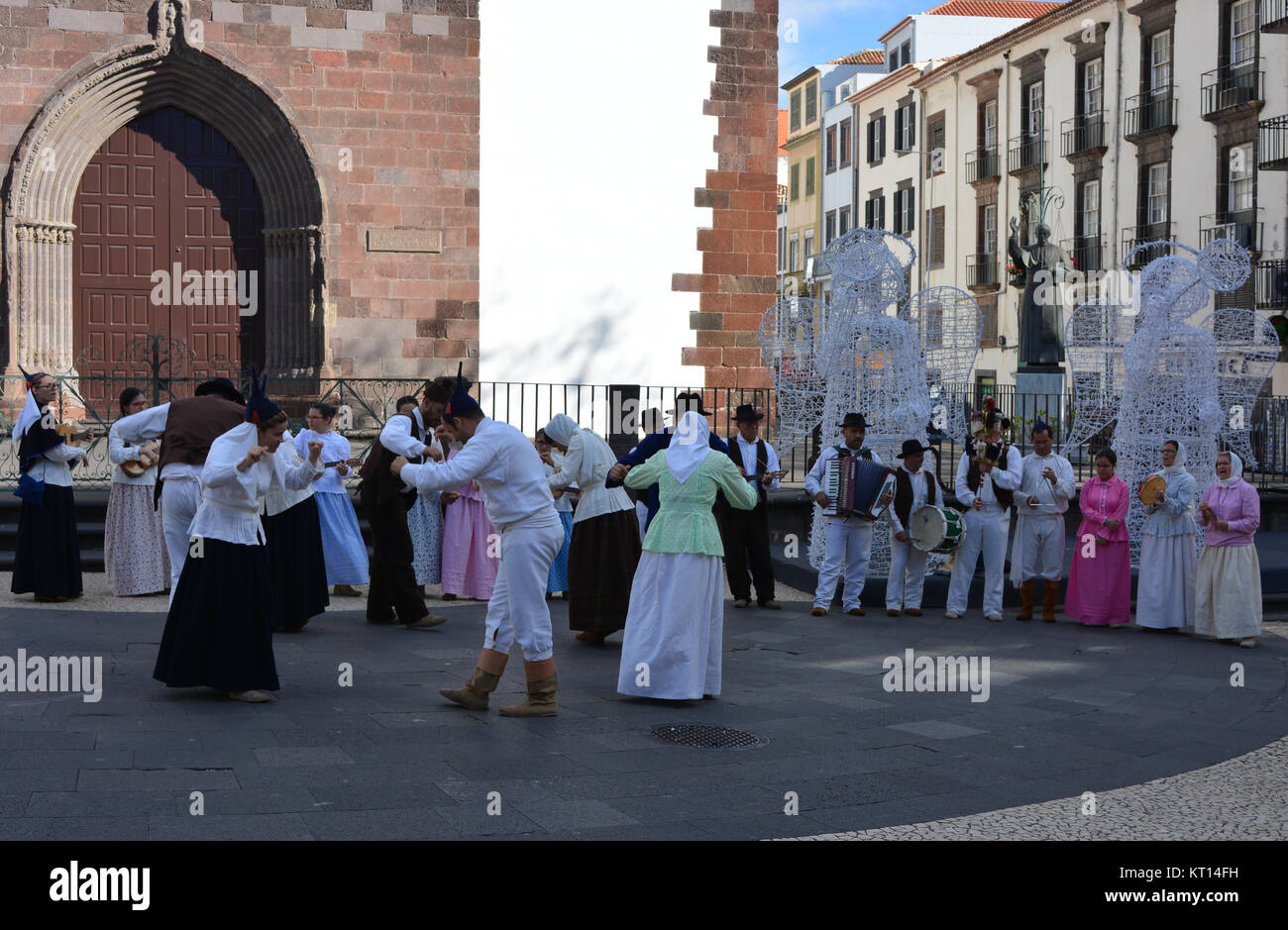 Traditional folk musicians and dancers outside the Cathedral, Funchal, Madeira, Portugal Stock Photo