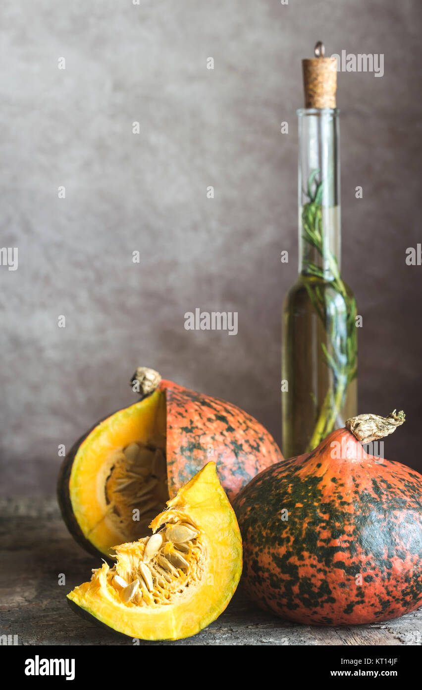 Two hokkaido pumpkins on the wooden background Stock Photo - Alamy