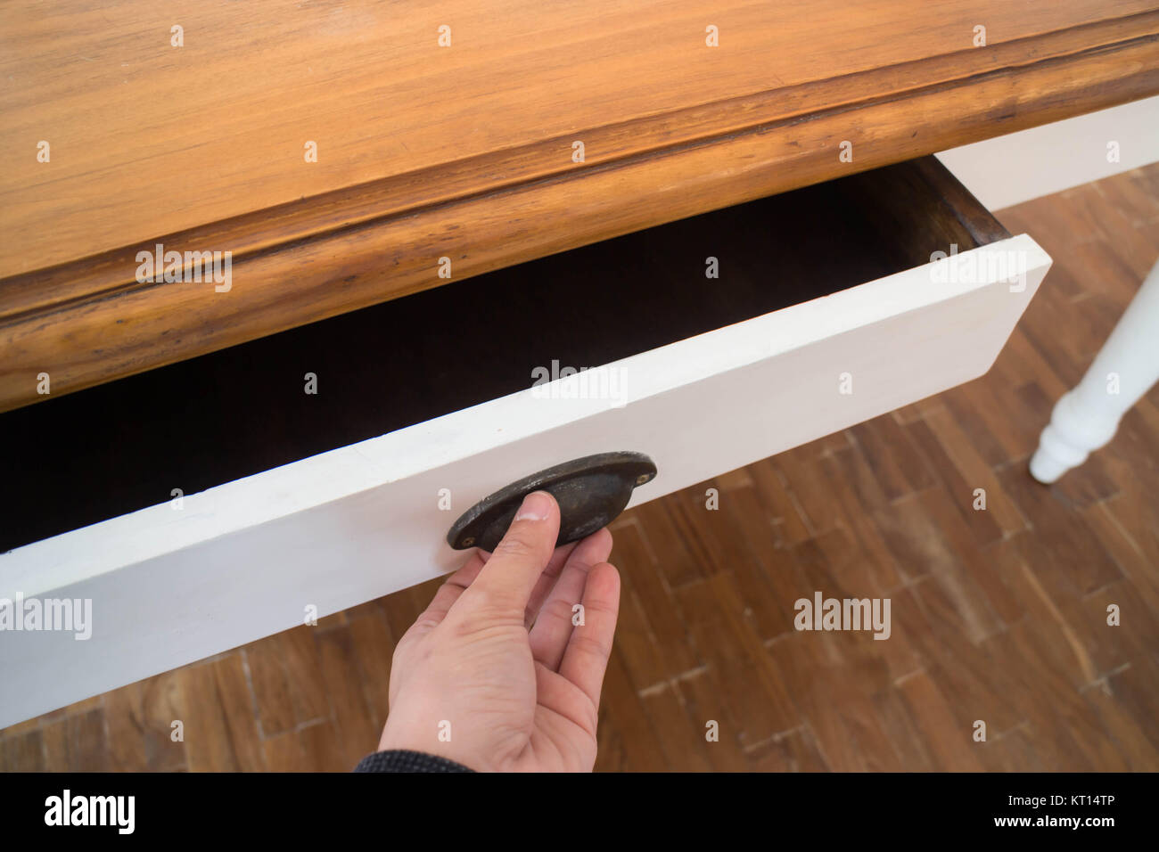 Hand open drawer box of wooden table Stock Photo - Alamy
